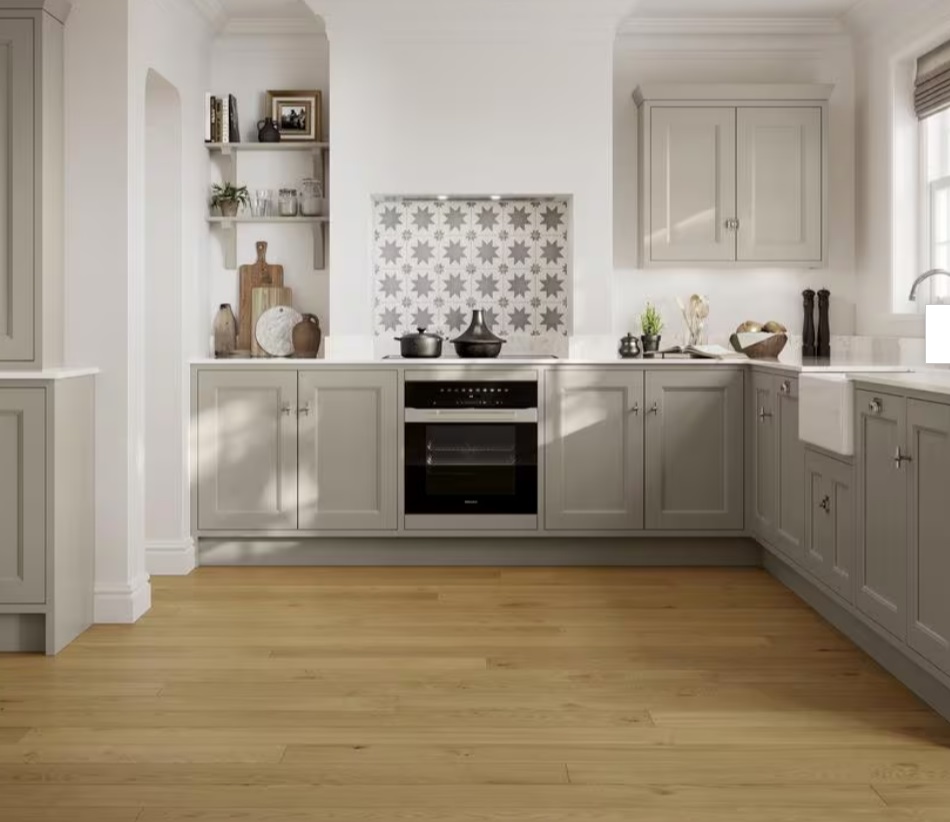 Light oak wood flooring fitted in a bright traditional kitchen